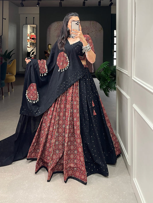 Navratri Lehenga Cholis AND Presenting to you our latest masterpiece of Navratri collection. Dress up into this printed new maroon color and the mirror work chaniya choli  to a create your garba look more significant