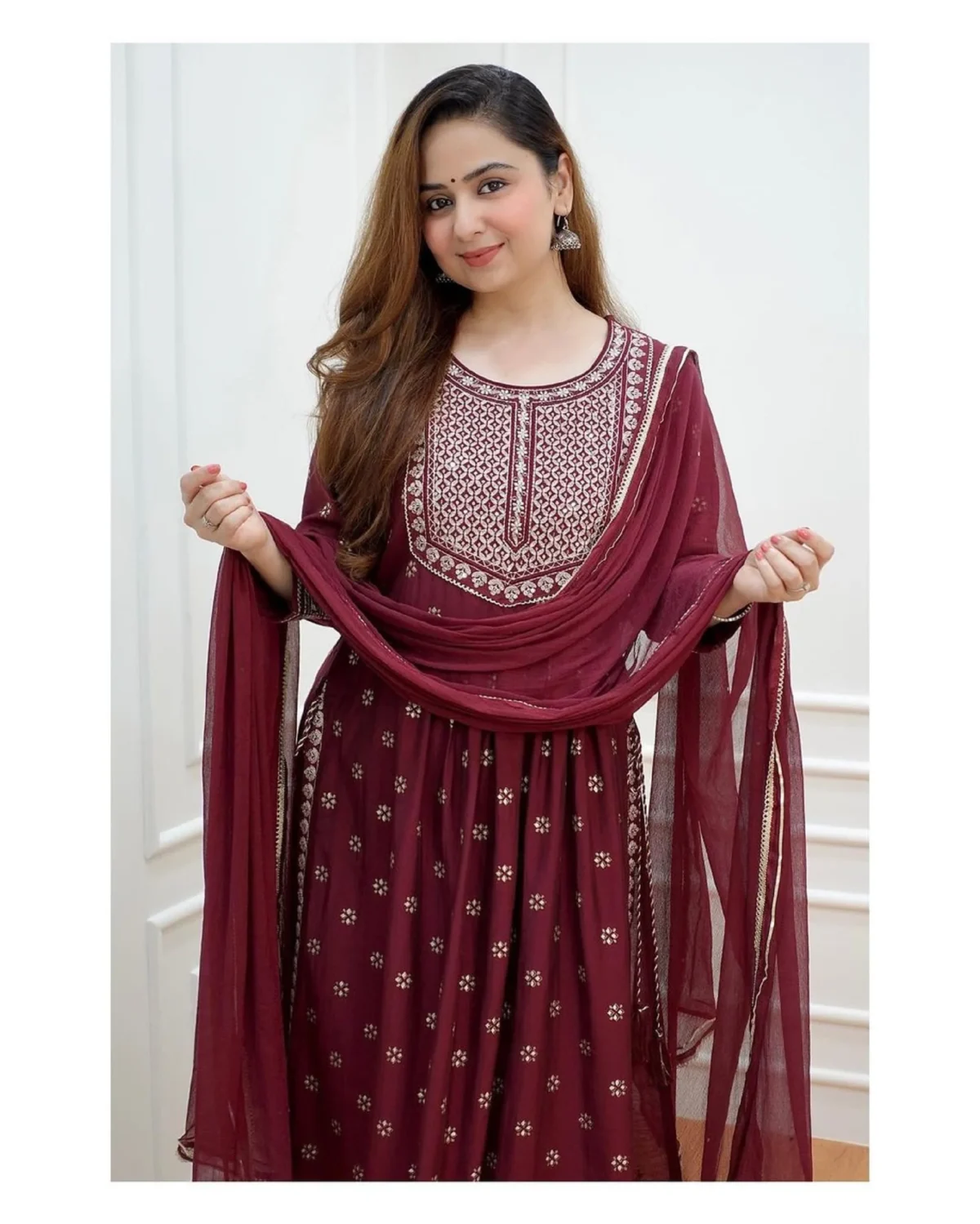 Elegant Pakistani 3-piece festive outfit for women featuring a red flared kurti with intricate embroidery, matching pants, and a flowy dupatta. Perfect ready-to-wear designer salwar kameez for parties and traditional occasions