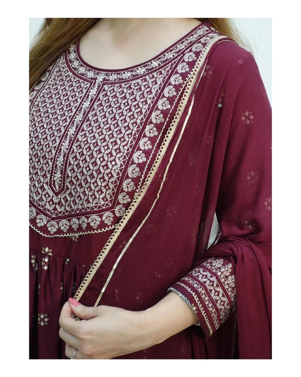 Elegant Pakistani 3-piece festive outfit for women featuring a red flared kurti with intricate embroidery, matching pants, and a flowy dupatta. Perfect ready-to-wear designer salwar kameez for parties and traditional occasions