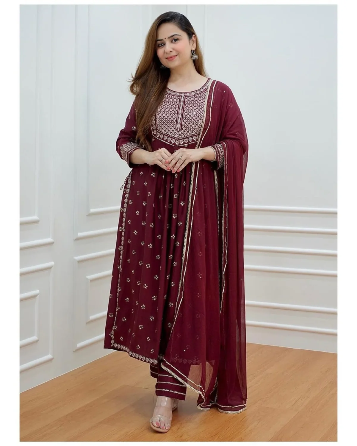 Elegant Pakistani 3-piece festive outfit for women featuring a red flared kurti with intricate embroidery, matching pants, and a flowy dupatta. Perfect ready-to-wear designer salwar kameez for parties and traditional occasions