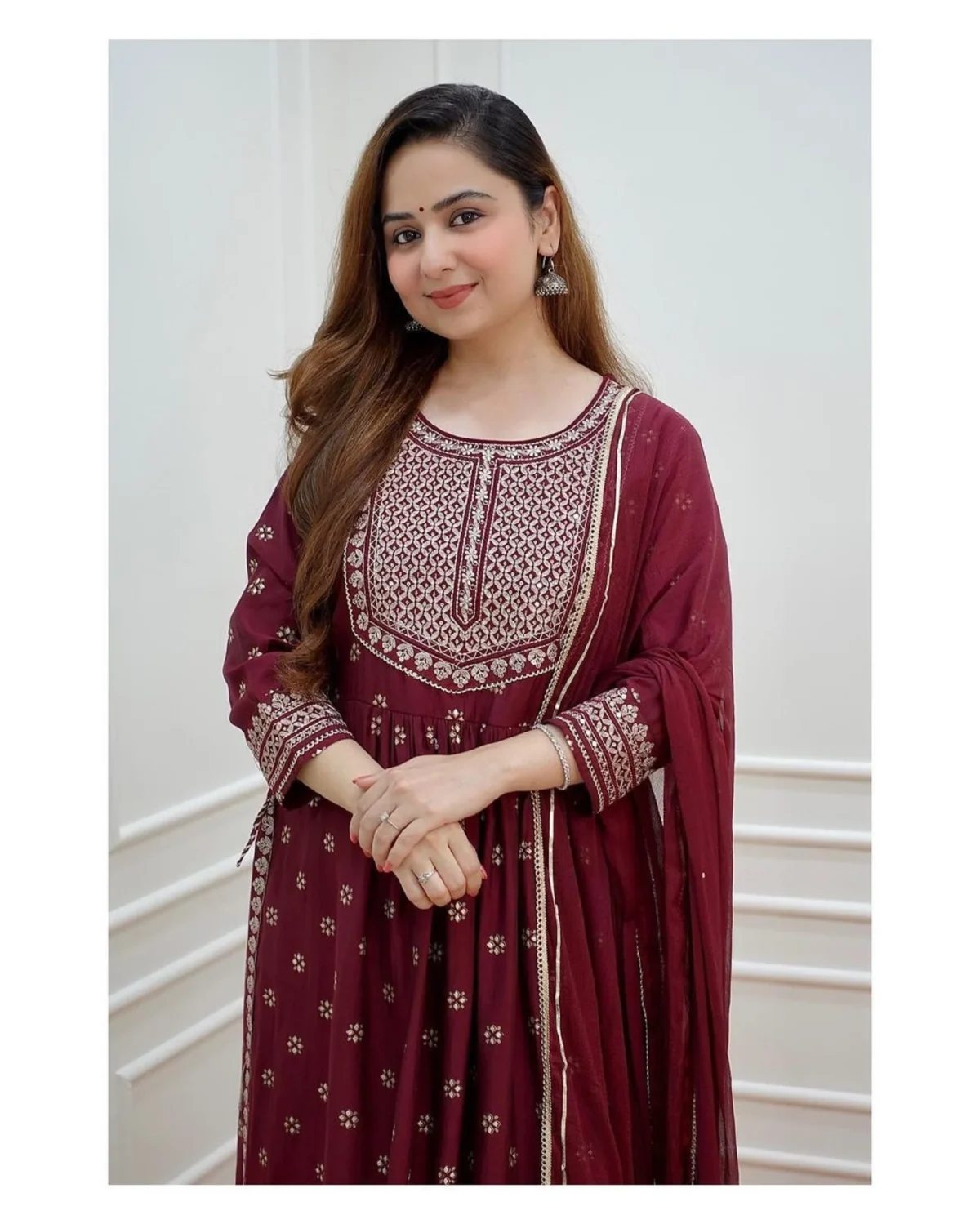 Elegant Pakistani 3-piece festive outfit for women featuring a red flared kurti with intricate embroidery, matching pants, and a flowy dupatta. Perfect ready-to-wear designer salwar kameez for parties and traditional occasions