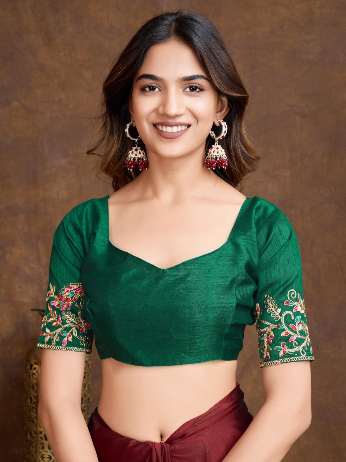 Maroon embroidered Saree with green unstitch blouse